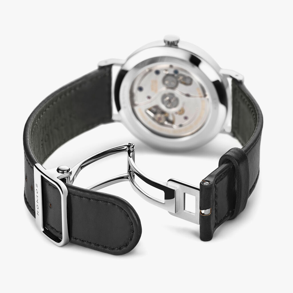 This beautiful fastening was designed exclusively to accompany the launch of the At Work series and is available separately. However, it fits all NOMOS straps with a width of 19 or 20 mm. The only exceptions are our textile straps and the cushioned straps for models Lux and Lambda. NOMOS deployant clasp from nickel-free surgical steel 316 L, lug width 18 millimeters.